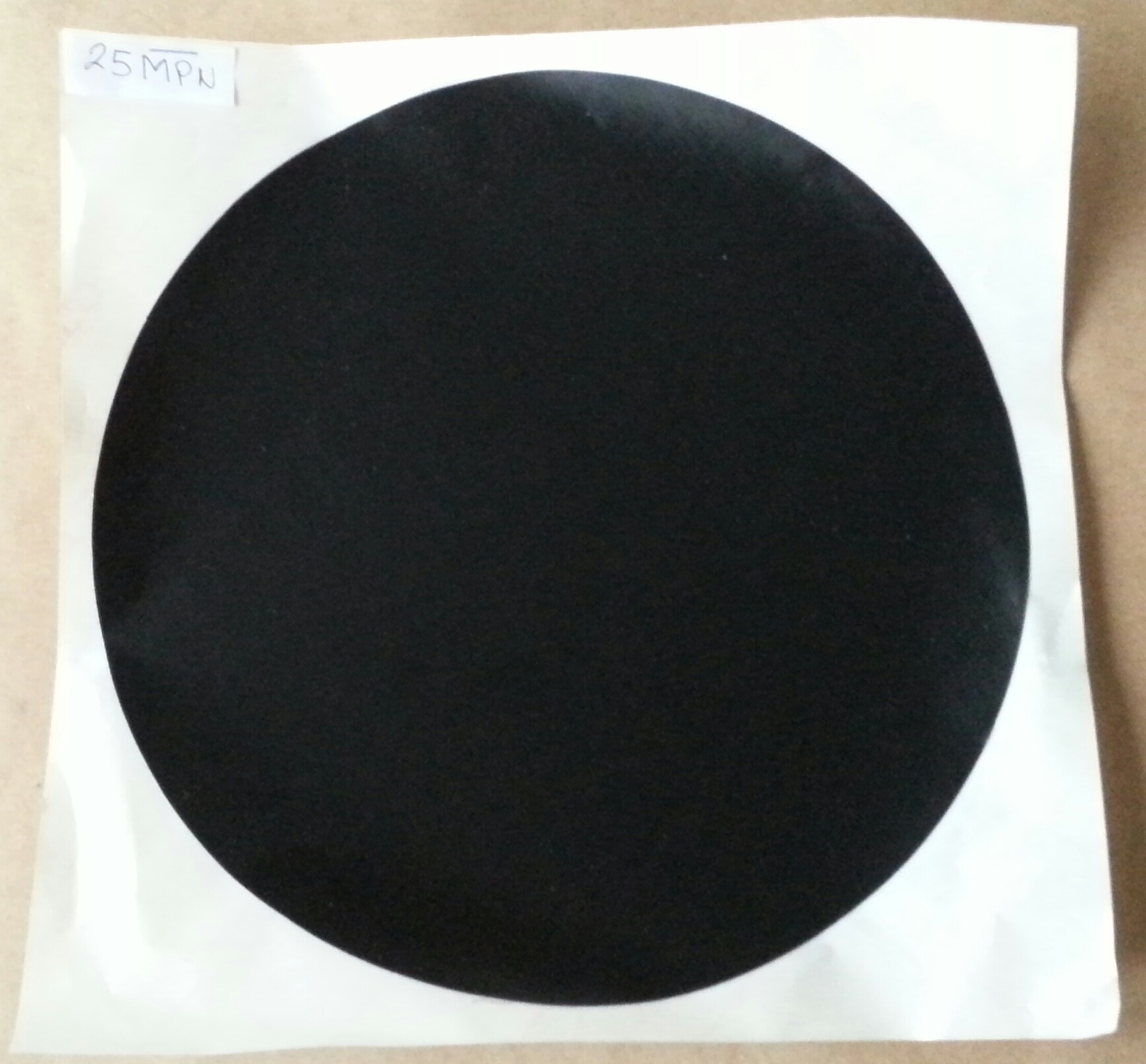 Adhesive round, black spot center for drum patch