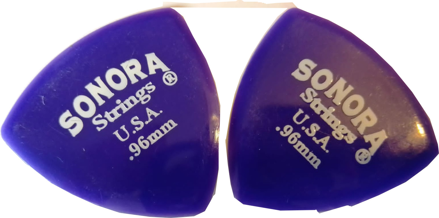 Purple, thick, shield shape, plectrum for guitars